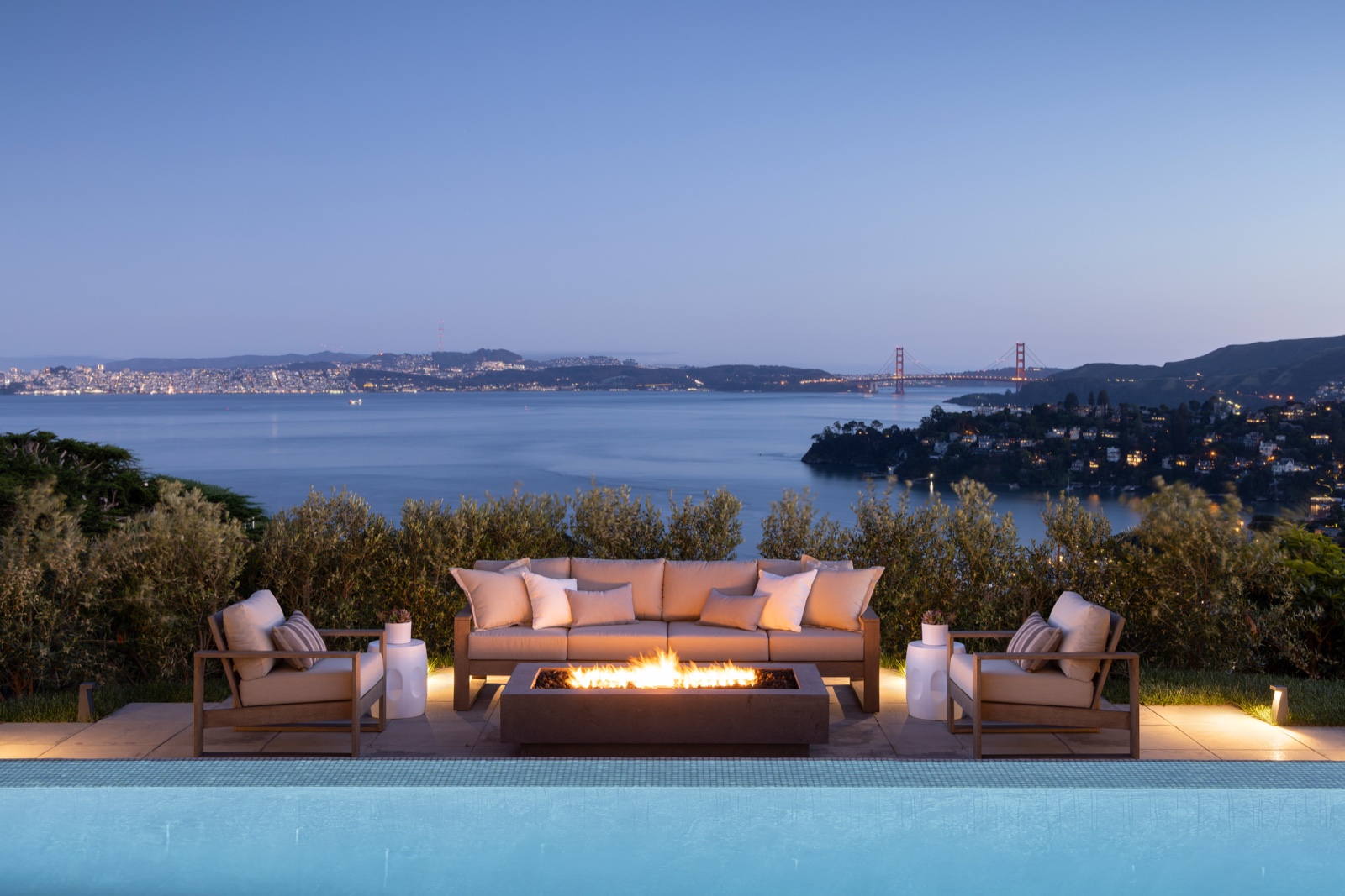Pool terrace at night with city lights